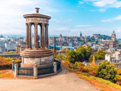 Monument with a city view in the background