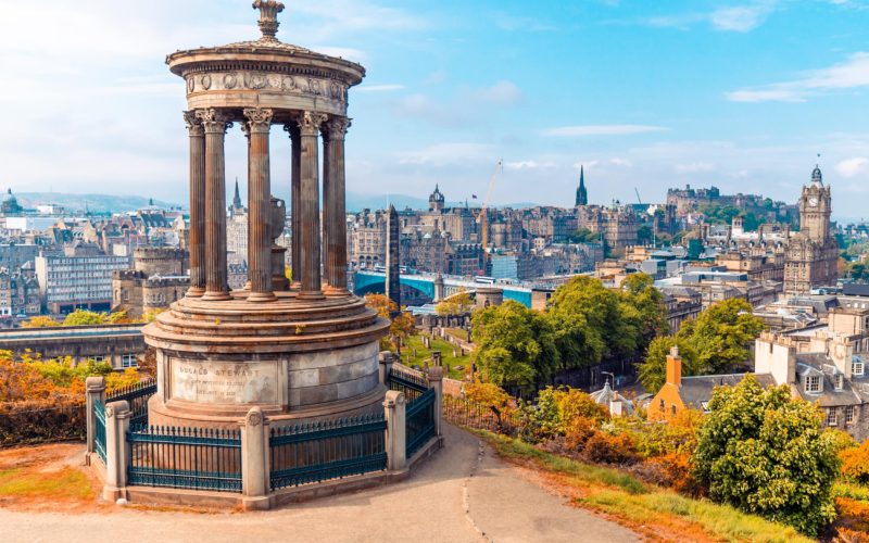 Monument with a city view in the background