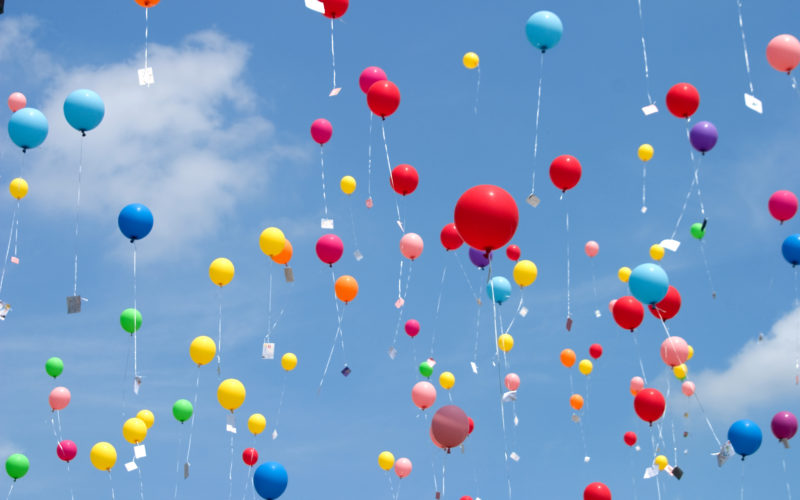 Colourful balloons flying up the sky