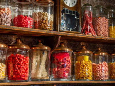 Old candy store. Colorful candies in jars. Old fashioned retro style