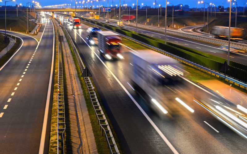 view of moving cars on a motorway at dawn
