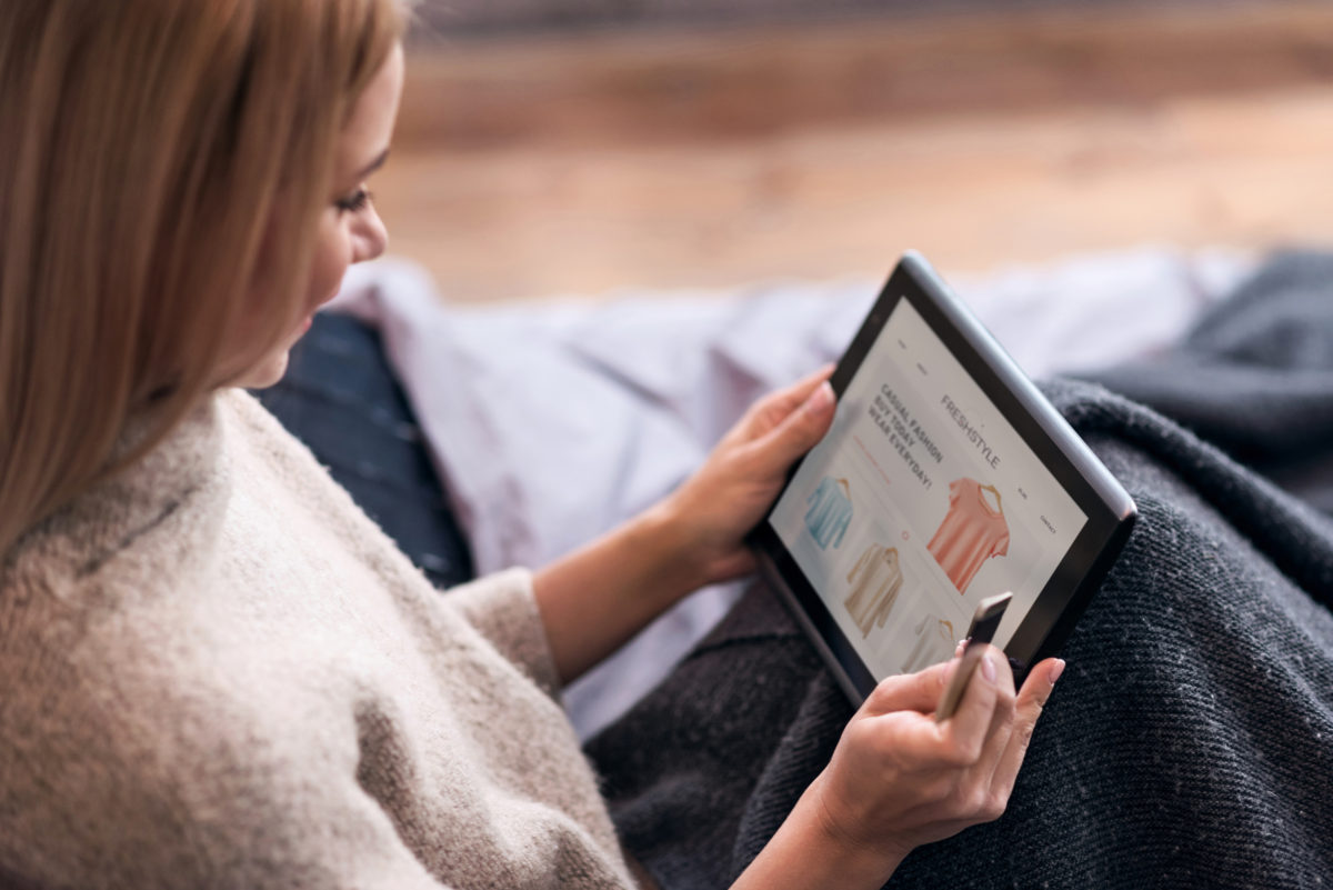 woman shopping online at her tablet