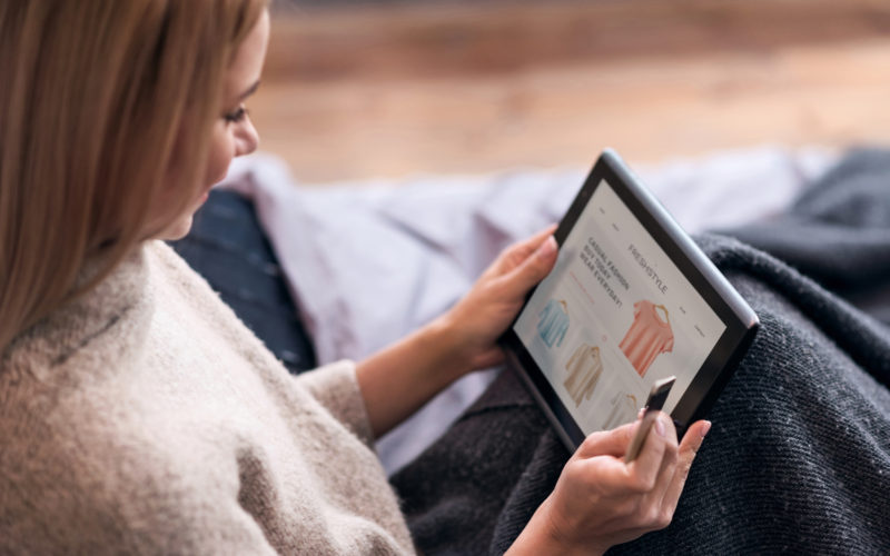 woman shopping online at her tablet