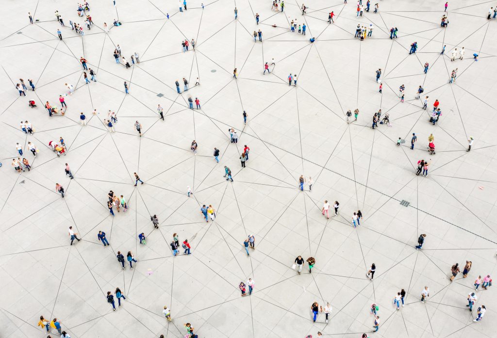 aerial view of people walking with lines connecting them - tungsten network world-class connected