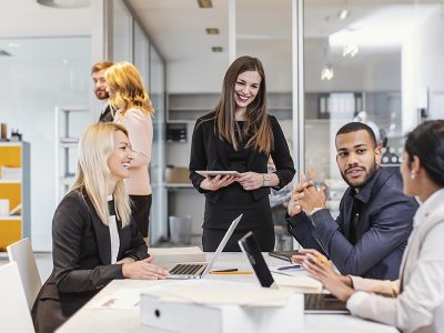 A group of coworkers meeting to discuss trending topics