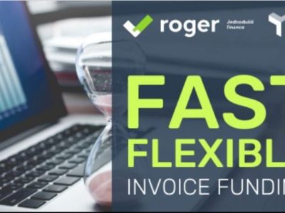 Glass egg timer on a laptop with graphs on a screen