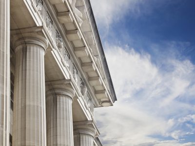A close up look at a courthouse or government building on a blue skies background