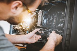 Man working on computer for high-tech company that would benefit from automating ap