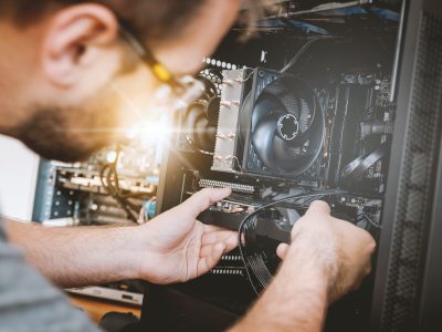 Man working on computer for high-tech company that would benefit from automating ap